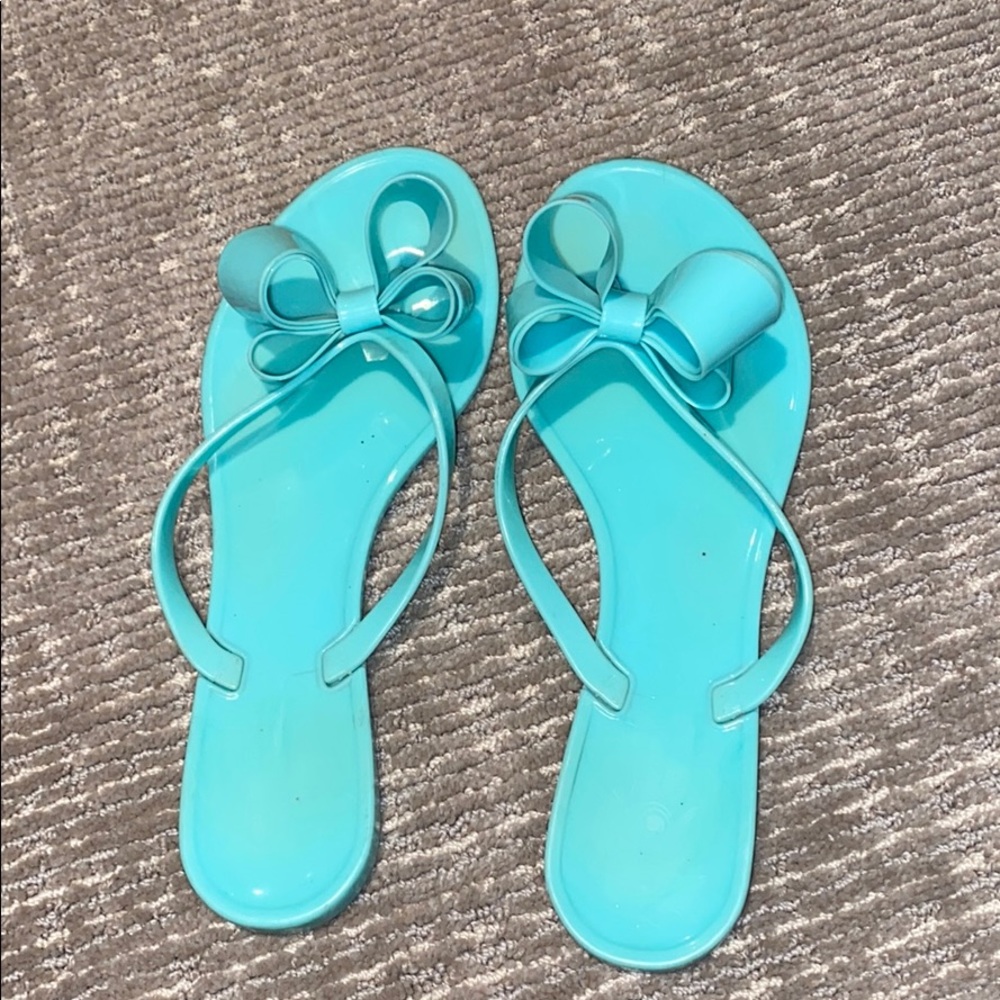 Dizzy teal flip-flops